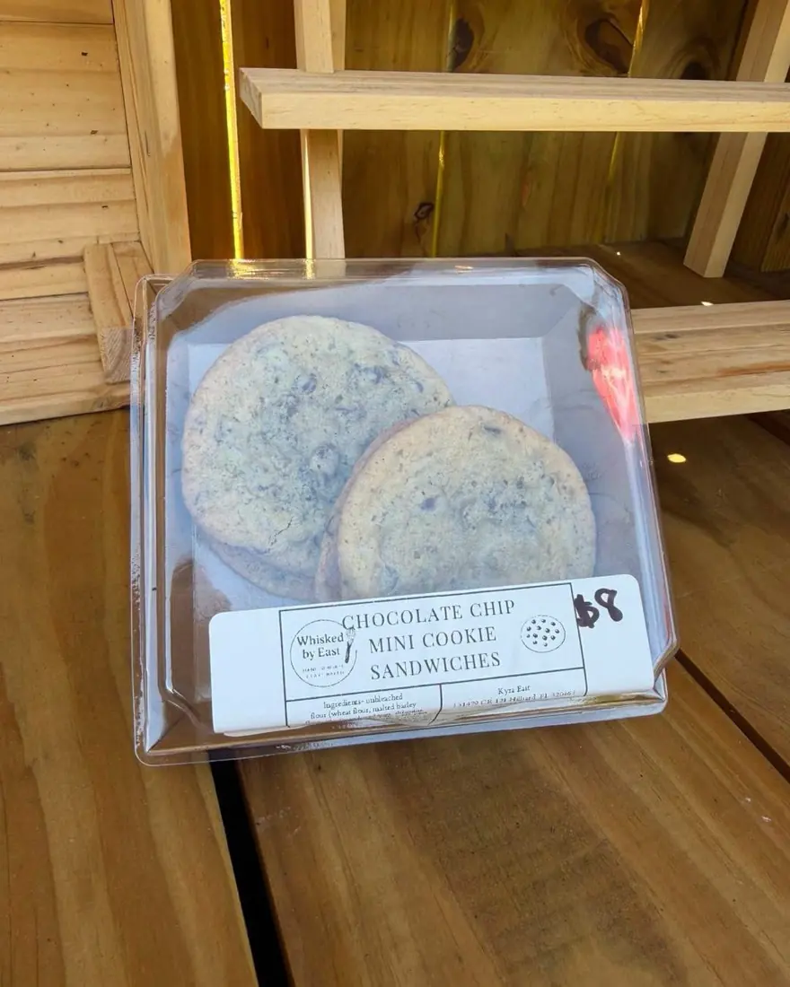 A boxed pair of chocolate chip mini cookie sandwiches on the stand shelf